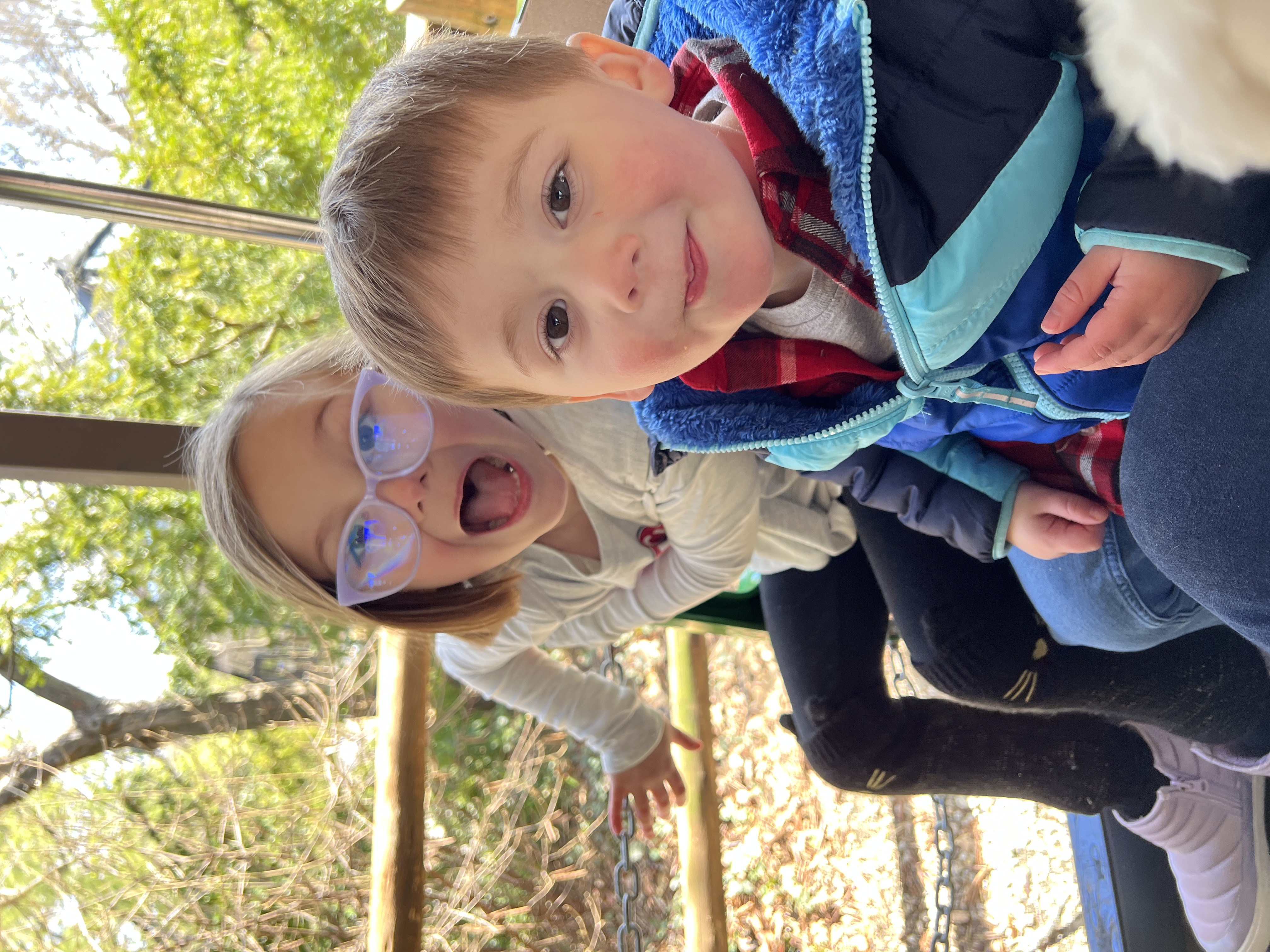 Two kids laughing on the train at the Cincinnati Zoo.